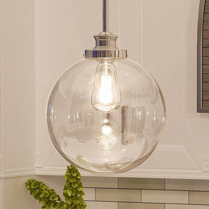 A beautiful vintage pendant lamp hanging over a kitchen counter.