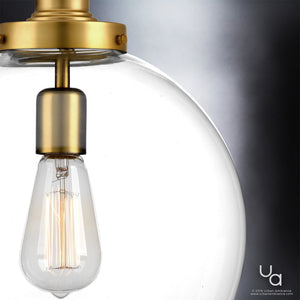 Close-up of the Urban Ambiance UHP2645 Vintage Pendant from the Glasgow Collection, featuring a clear glass globe, visible filament bulb, and native brass finish, measuring 15″H x 12″W—an elegant modern lighting accent for any space.