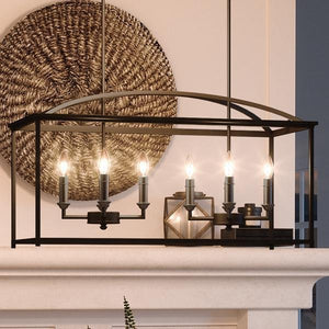 A unique Moroccan Chandelier, 16.5"H x 30.125"W, Olde Bronze Finish from the Mackay Collection by Urban Ambiance hanging over a fireplace mantle.