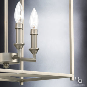 A beautiful Moroccan chandelier, part of the Mackay Collection, featuring a brushed nickel finish and three candle lights.