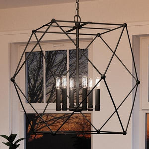 A beautiful UHP2702 Contemporary Chandelier, 26"H x 28"W, Midnight Black Finish from the Aberdeen Collection by Urban Ambiance illuminates a living room window.