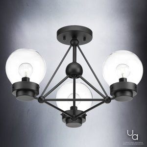 The UHP2705 Contemporary Ceiling Fixture from Urban Ambiance’s Aberdeen Collection features a midnight black finish and three clear glass globe shades with exposed bulbs. Measuring 14 inches high by 19.625 inches wide, this modern fixture blends industrial design with sleek geometric lines for a striking statement piece, displayed against a gray gradient background. The Urban Ambiance logo appears in the bottom right corner.