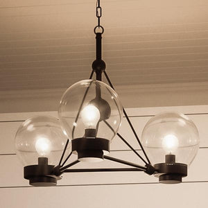 The Urban Ambiance UHP2705 Contemporary Ceiling Fixture from the Aberdeen Collection features three clear glass globes set in a modern metal frame with a midnight black finish. Measuring 14″ high by 19.625″ wide, this striking chandelier is designed to be suspended from ceilings with horizontal paneling.