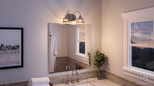 Bathroom interior featuring a mirror, vanity sink, potted plant, towel, framed photo, a window with a sunset view, and the Urban Ambiance UHP2720 Vintage Bathroom Vanity Light from the Eugene Collection (8.375″H x 15″W) in brushed nickel finish.