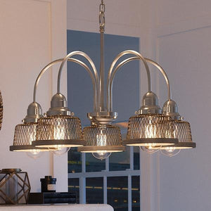 A unique UHP2724 Vintage Chandelier with four lights in a living room.