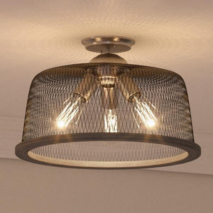 The UHP2732 Vintage Ceiling Fixture from the Eugene Collection by Urban Ambiance features a brushed nickel finish and measures 10.25 inches high by 16 inches wide. Mounted close to the ceiling, this industrial light fixture makes a bold statement in any space with its stylish design.