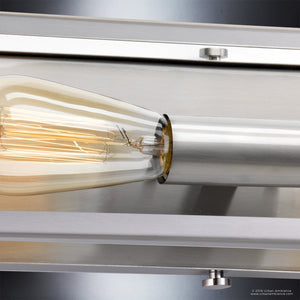 Close-up of the UHP2752 Luxe Industrial Electric Bath Fixture by Urban Ambiance, featuring a vintage-style light bulb with visible filament set in a stainless steel socket and brushed metal fixture—an elegant design from the Messina Collection, ideal as a modern bath light.