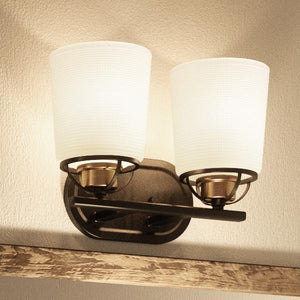 Two Unique Urban Ambiance UHP2760 Transitional Bath Fixtures, 8-1/8"H x 14-1/8"W, hanging on a wooden wall.