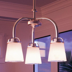 Three beautiful Urban Ambiance UHP2763 Transitional Chandeliers hanging over a window.