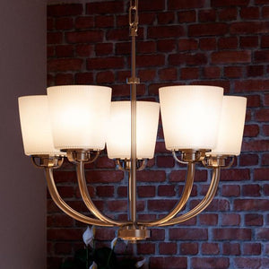 A gorgeous chandelier from the Urban Ambiance Boise Collection, featuring white shades and a brushed nickel finish, perfect for adding luxury to any space.