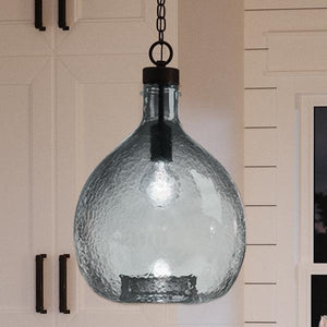 A unique and beautiful lamp, the UHP2771 Modern Farmhouse Pendant from the Hobart Collection by Urban Ambiance adds a touch of elegance as it hangs over a kitchen counter.