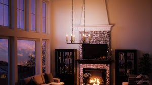 A living room with a beautiful lighting fixture, the UHP2802 Modern Farmhouse Farmhouse Chandelier by Urban Ambiance.