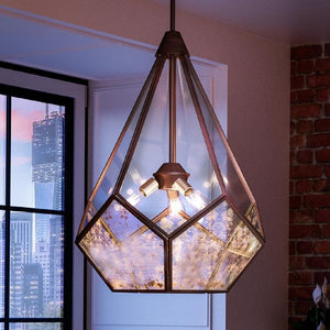 The Urban Ambiance UHP2851 Mid-Century Modern Chandelier from the Bari Collection, featuring an Olde Bronze finish and measuring 25-7/8″ x 19″, hangs from the ceiling near a window with a city view in the background.