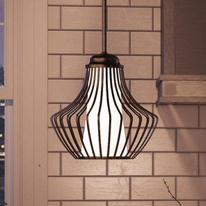 An Urban Ambiance pendant light from the Oviedo Collection, 10-1/2" x 10", with a Midnight Black Finish is hanging over a window in a kitchen, providing unique