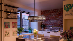 An image of a kitchen with a luxury lighting fixture, the UHP2882 Cosmopolitan Farmhouse Crystal Chandelier from the Lille Collection by Urban Ambiance, hanging over a table.