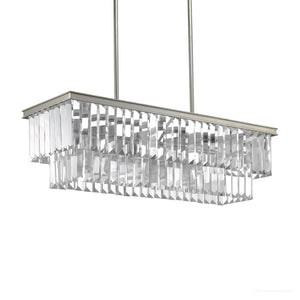 The UHP2883 Cosmopolitan Chandelier from the Lille Collection by Urban Ambiance features a rectangular design with two tiers of prismatic glass prisms and a striking metal frame in an Antique Silver finish, elegantly suspended from the ceiling by two rods. It measures 11″ x 33-7/8″.