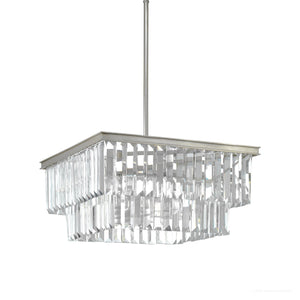 The Urban Ambiance UHP2885 Cosmopolitan Chandelier from the Lille Collection features a square silhouette with two tiers of vertical rectangular prismatic clear glass prisms and an antique silver finish frame, suspended elegantly from a rod. Measuring 11″ x 20-1/8″, this luxurious decorative chandelier is perfect for enhancing any sophisticated space.