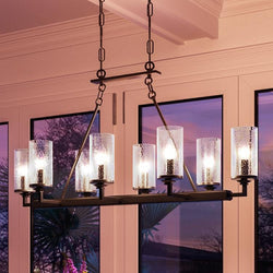 A gorgeous lighting fixture, the Urban Ambiance UHP2894 Rustic Chandelier from the Livorno Collection hangs luxuriously over a window with its Charcoal Finish.