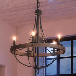 A unique UHP2901 Farmhouse Farmhouse Chandelier, 30" x 26", Charcoal Finish, Adelaide Collection by Urban Ambiance adorned with four candles hanging from it.