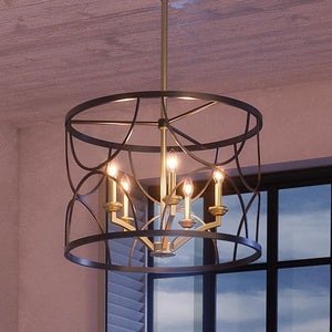 A UHP2912 French Rustic Chandelier from Urban Ambiance’s Breda Collection, featuring a circular midnight black metal frame and exposed bulbs, hangs from the ceiling near a window.