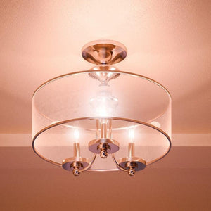 A unique lighting fixture, UHP2920 Cosmopolitan Ceiling Light by Urban Ambiance, in a room with a glass shade.