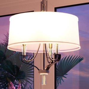 An UHP2942 Modern Farmhouse Chandelier with a white shade in front of a window, made by Urban Ambiance, is a gorgeous lighting fixture.