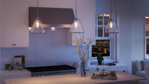A kitchen with white cabinets and a view of the city featuring the Urban Ambiance UHP2990 Industrial Pendant Light, 13