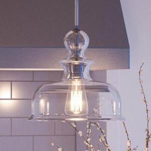 A beautiful UHP3040 Modern Farmhouse pendant lamp hanging over a kitchen counter.