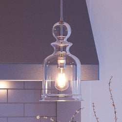 A unique pendant light in a stunning modern farmhouse kitchen.