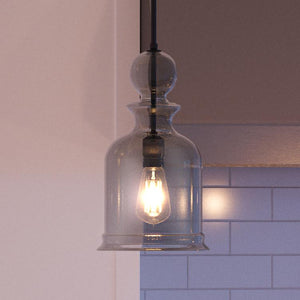 A unique and gorgeous Modern Farmhouse pendant light from the Dundee Collection, hanging over a kitchen counter.