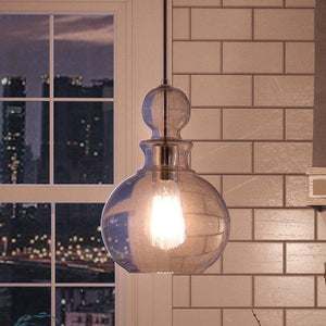 An UHP3046 Modern Farmhouse Farmhouse Pendant Light, 12-3/4" x 8-1/2", Brushed Nickel Finish from the Dundee Collection by Urban Ambiance hanging over a kitchen counter.