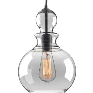 The UHP3047 Modern Farmhouse Pendant Light from Urban Ambiance’s Dundee Collection features a round, bulbous clear glass shade that showcases a visible vintage-style Edison bulb suspended inside. Handcrafted with a striking charcoal finish, this pendant brings a touch of vintage-modern lighting to any space.