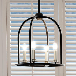 A beautiful Colonial Pendant Light with three gorgeous lights hanging from a window.