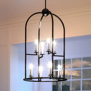 A beautiful Colonial Chandelier, 32"H x 19.625"W, Midnight Black Finish, Somerville Collection hanging in a room.
