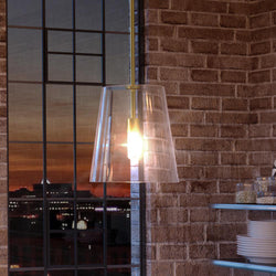 A gorgeous lighting fixture from the Urban Ambiance Tustin Collection hangs over a window in a kitchen.