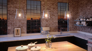 A beautiful kitchen with a unique lighting fixture, the Urban Ambiance UHP3070 Colonial Pendant Light in Satin Gold Finish from their Tustin Collection, offering a view of the city skyline.