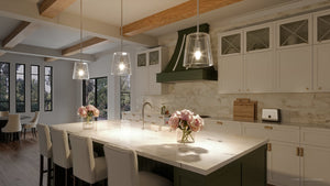 A beautiful lighting fixture, the UHP3090 Colonial Pendant Light from Urban Ambiance's Tustin Collection, enhances the aesthetics of a kitchen with white cabinets and green countertops.