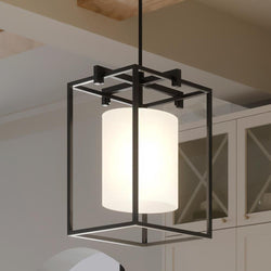 An UHP3111 Minimalist Pendant Light with a glass shade hanging over a kitchen counter, providing gorgeous lighting fixture.