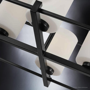 A beautiful UHP3122 Minimalist Chandelier with Midnight Black Finish and Kennewick Collection brand, featuring four glass shades.