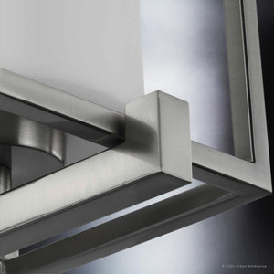 A luxurious and beautiful lighting fixture, the UHP3140 Minimalist Wall Light from the Kennewick Collection by Urban Ambiance features a white glass and a square frame measuring 18