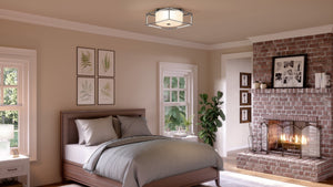 A bedroom with a UHP3150 Minimalist Ceiling Light and a bed and a fireplace, featuring a unique brushed nickel finish from the Kennewick Collection by Urban Ambiance brand.