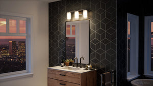 A gorgeous bathroom with a view of a city equipped with the UHP3180 Contemporary Bath Vanity Light from the Evanston Collection by Urban Ambiance.