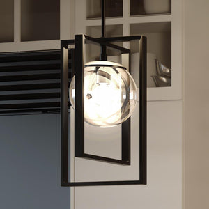 An UHP3251 Minimalist Pendant Light with a glass globe hanging from it, providing a unique touch to any space.