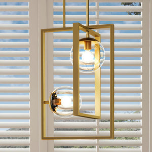 A beautiful UHP3262 minimalist lamp by Urban Ambiance hanging over a window with blinds.