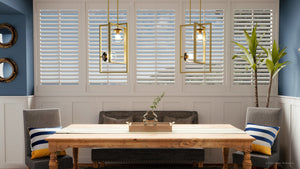 A dining room with blue shutters and a UHP3262 Minimalist Pendant Light, 20.5