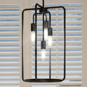 An UHP3281 Urban Loft Pendant Light, 22.875"H x 14.5"W, Midnight Black Finish from the Loveland Collection by Urban Ambiance hanging over a window, creating