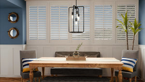 A dining room with a unique lighting fixture - the UHP3281 Urban Loft Pendant Light, 22.875