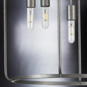 Urban Loft pendant light, with a Galvanized Steel Finish, from the Loveland Collection featuring three hanging light bulbs.