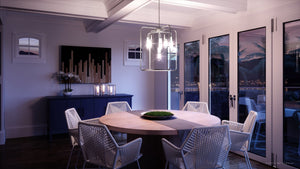 A dining room with a gorgeous UHP3290 Urban Loft Pendant Light, 23.125