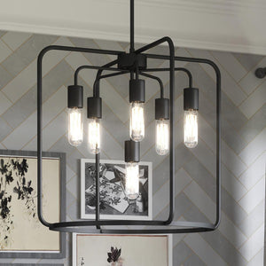 A unique UHP3291 Urban Loft Pendant Light hanging over a dining room table.